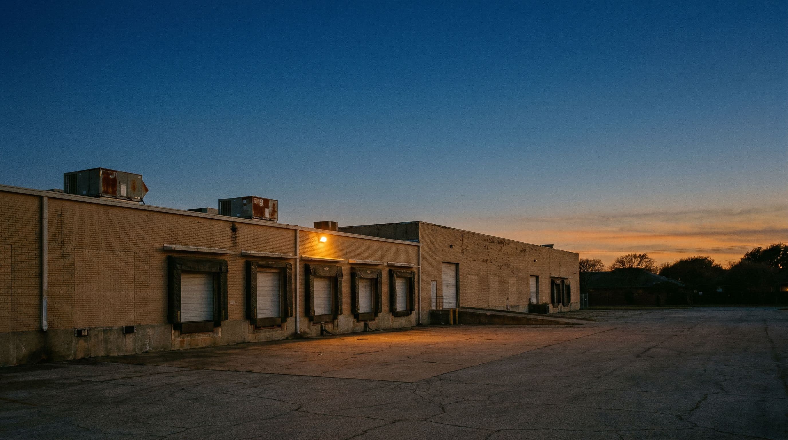 Farmers Branch, TX commercial property at dusk.
